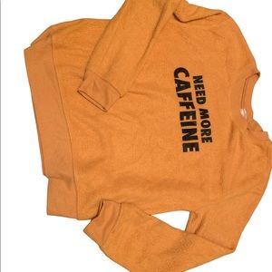 Yellow fuzzy sweater.